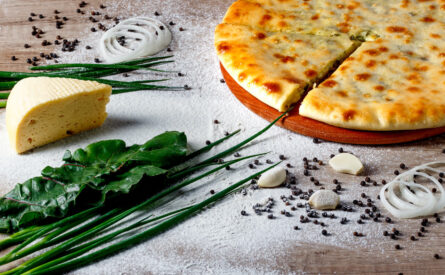 Осетинский пирог сыром, зеленью и грибами.